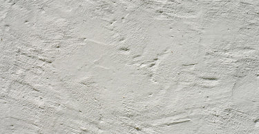 Step-by-step process of applying Dholpur texture on an exterior wall for a durable finish